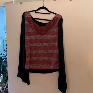 Long sleeve shirt with white designs that look like flowers